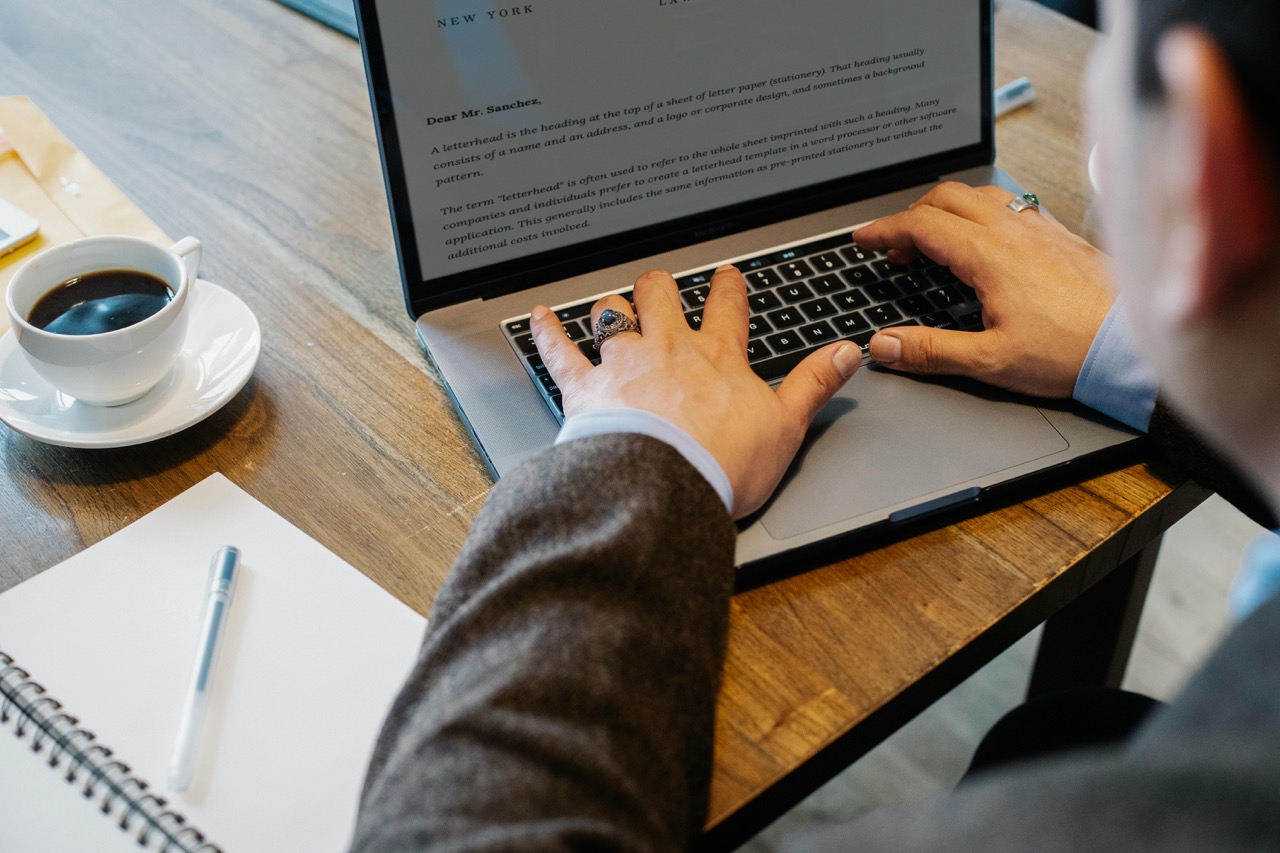 A Man is Typing with Computer