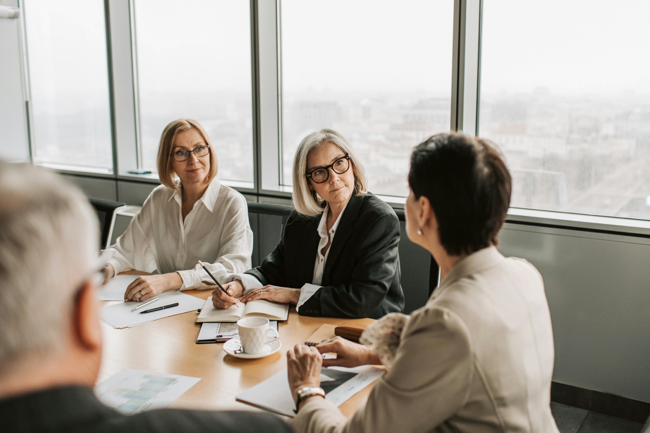 Two Customers are Consulted by A Business Man